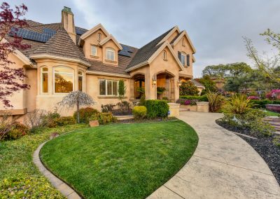 front of luxury home with circular driveway