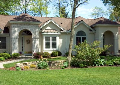 Attractive ranch home with many roof peaks and arches. Just one of many new home or house photos in my gallery.